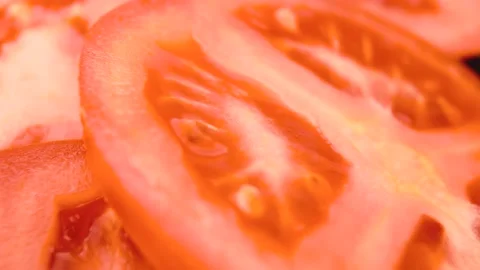 Squeezed juicy red tomato. Macro photography. Close-up Stock Footage 151152728