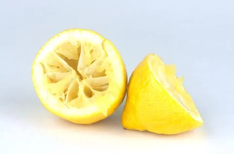 Squeezed lemon on a white background in 스톡 사진
