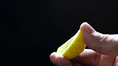 Squeezed lime in slow motion. Lime on black background Stock-Footage 124038772