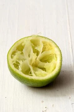 Squeezed slice of lime Stock Photos