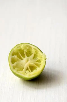 Squeezed slice of lime Stock Photos