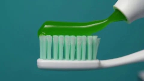 Squeezed toothpaste on toothbrush close up. Stock Footage 83144419