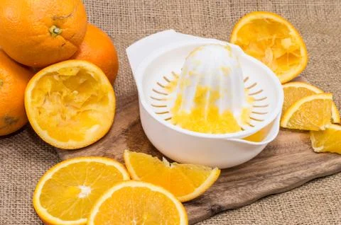 Squeezer with fresh oranges Stock Photos