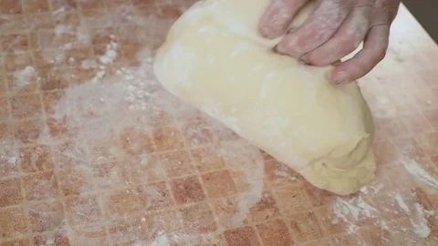 Squeezes the dough with his own hands Stockbeeldmateriaal 80042856