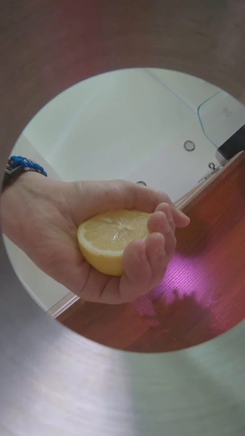 Squeezes a lemon into a shaker Stock Footage 130051532