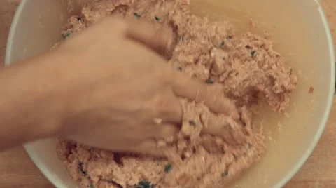 Squeezing and mixing a tasty meat in a bowl Stock Footage 63428531