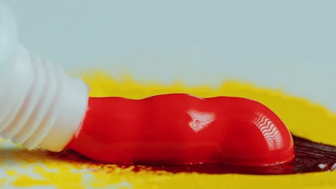 Squeezing Bright Red Paint Out of Tube Stock Footage 276919924