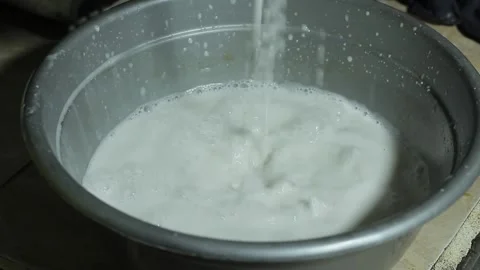 Squeezing coconut milk Stock Footage 286106131