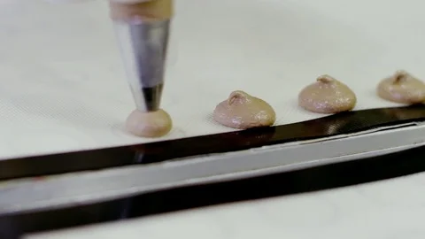 Squeezing the dough for macarons Stock Footage 72298954