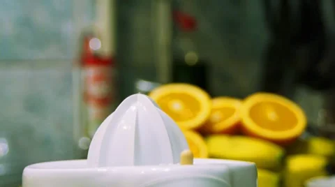 Squeezing fresh juice out of ripe tasty oranges and grapefruits Video stock 7748890