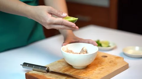 Squeezing Fresh Lime Juice onto Shrimps 스톡 동영상 334323876