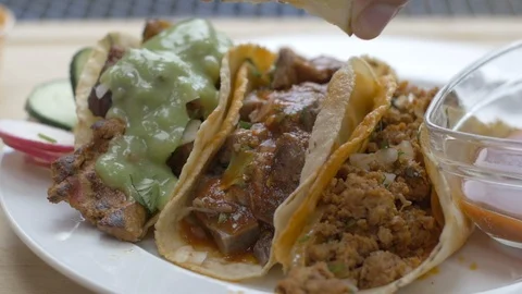 Squeezing a Fresh Lime on Tacos Stock Footage 113661841