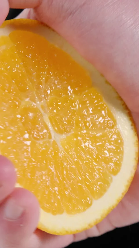 Squeezing Fresh Orange Juice by Hand Video stock 302506789