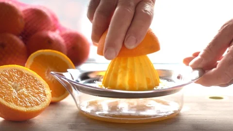 Squeezing Fresh Oranges To Make Juice Stock Footage 102610041