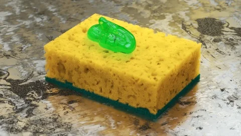 "Squeezing green liquid dishsoap detergend on a yellow sponge. Kitchen cleaning" Stock Footage 97464925