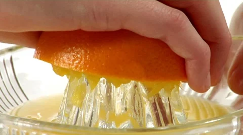 Squeezing half an orange Stock Footage 8573352