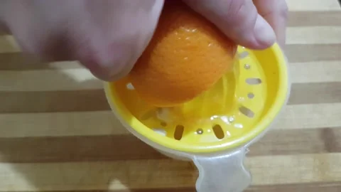 Squeezing half an orange with a juicer 스톡 동영상 134271673