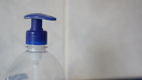 Squeezing hand soap dispenser Stock Footage 154248011