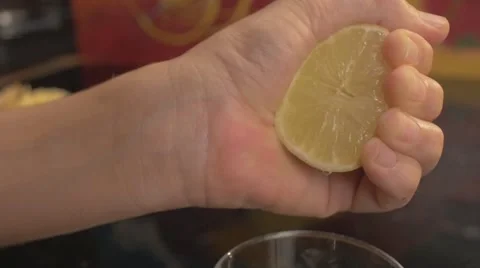 Squeezing juicy lemon Stock Footage 62598222