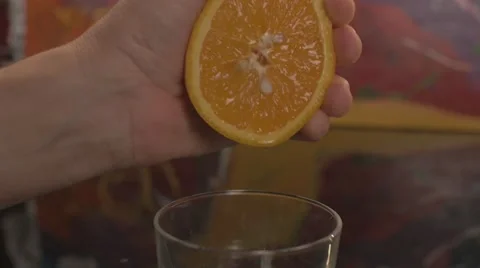 Squeezing a juicy orange Stock Footage 62598072