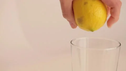 Squeezing a lemon Stock Footage 133813590