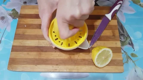 Squeezing lemon Stock Footage 137195829