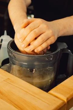 Squeezing  lemon in  home kitchen prepare fresh juice, add flavor to  dish or Stock Photos