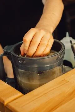 Squeezing  lemon in  home kitchen prepare fresh juice, add flavor to  dish or Stock Photos