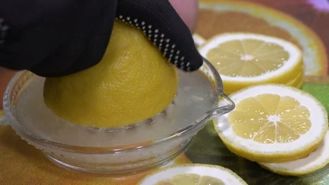 Squeezing with a lemon juice dispenser Stock-Footage 88041473