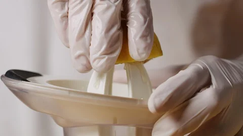 Squeezing lemon on juicer macro shot Stock-Footage 128487316