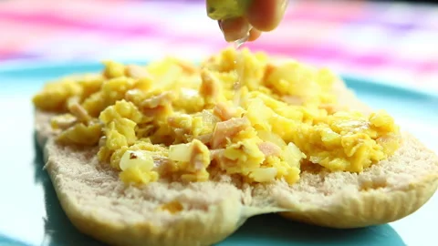 Squeezing  lemon on scrambled eggs   ,  close up in studio Chiangmai Thailand. Stock Footage 166391288
