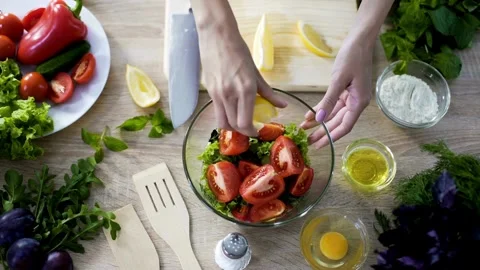 Squeezing Lemon Vegan Lettuce Salad Dressing. Vegan Raw Food On Diet. Stock-Footage 336588726