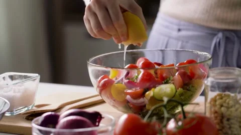 Squeezing Lemon Vegan Lettuce Salad Dressing. Vegan Raw Food On Diet. Stock-Footage 336588749
