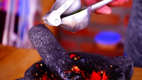 Squeezing lemons for hot sauce Stock Footage 129402243