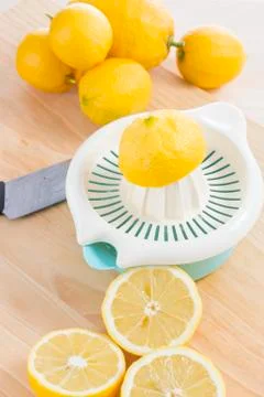 Squeezing lemons Stock Photos