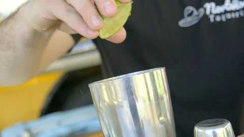 Squeezing a lime, camera rotation Stock Footage 233997205