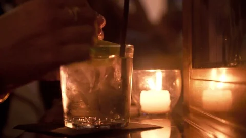 Squeezing Lime Into Drink Stock Footage 129624645