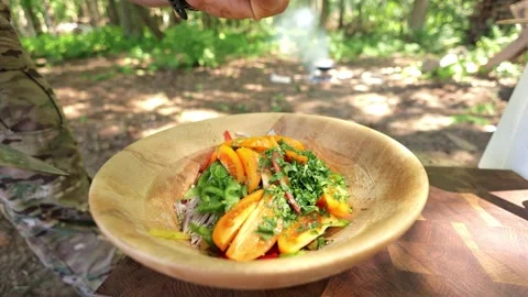 Squeezing Lime on Fresh Salad Outdoors Stock-Footage 280099699