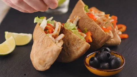 Squeezing lime juice on a pita Stock Footage 72193378