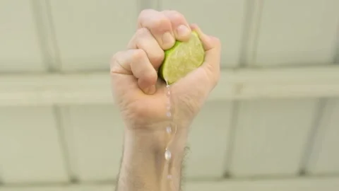 Squeezing a lime low angle Stock Footage 233997192