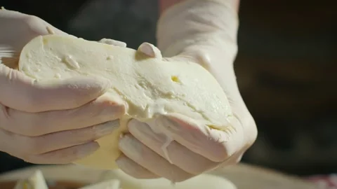 Squeezing milk from cheese Video stock 138127098