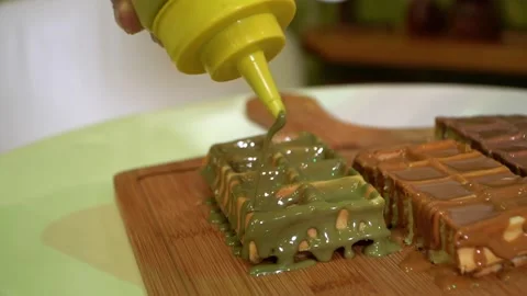 Squeezing Mustard on Dessert Stock Footage 318303245