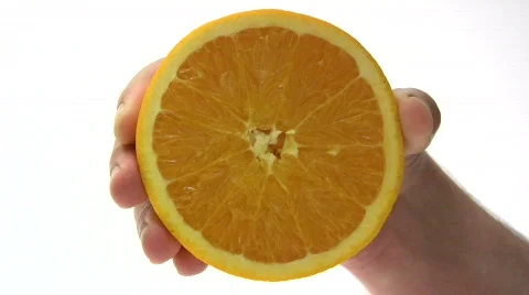 Squeezing an Orange Video stock 124619