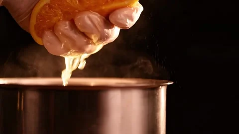 Squeezing orange fruit in slow motion Stock Footage 150768069