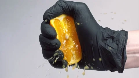 Squeezing orange fruit in slow motion Stock Footage 150768127