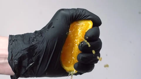 Squeezing orange fruit in slow motion Stock Footage 150771798