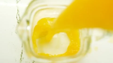 Squeezing an orange by hand 動画素材 281446027