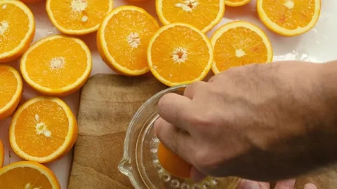 Squeezing an orange by hand Stock-Footage 281447246