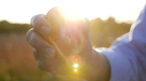 Squeezing orange - juice spashes Stock Footage 58165027