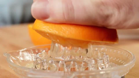 Squeezing Orange in Kitchen Stock Footage 22823544